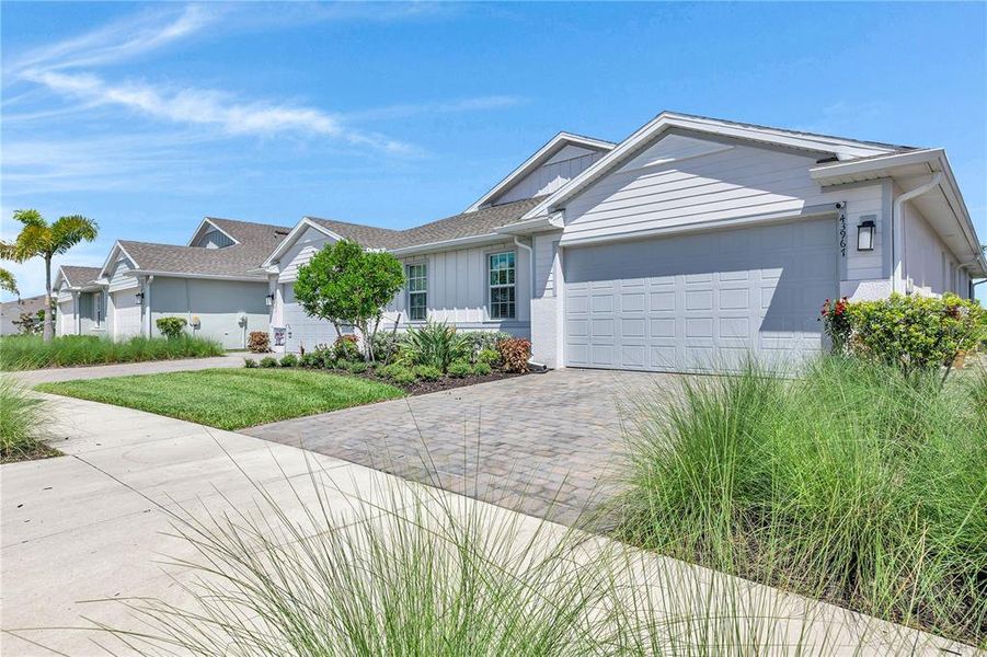 Front exterior of a new home in , Punta Gorda, FL, highlighting curb appeal (Image 24).