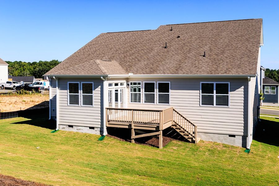 Front exterior of a new home in High Grove Oaks, Fuquay Varina, NC, highlighting curb appeal (Image 23). Front exterior of a new home in High Grove Oaks, Fuquay Varina, NC, highlighting curb appeal (Image 23).