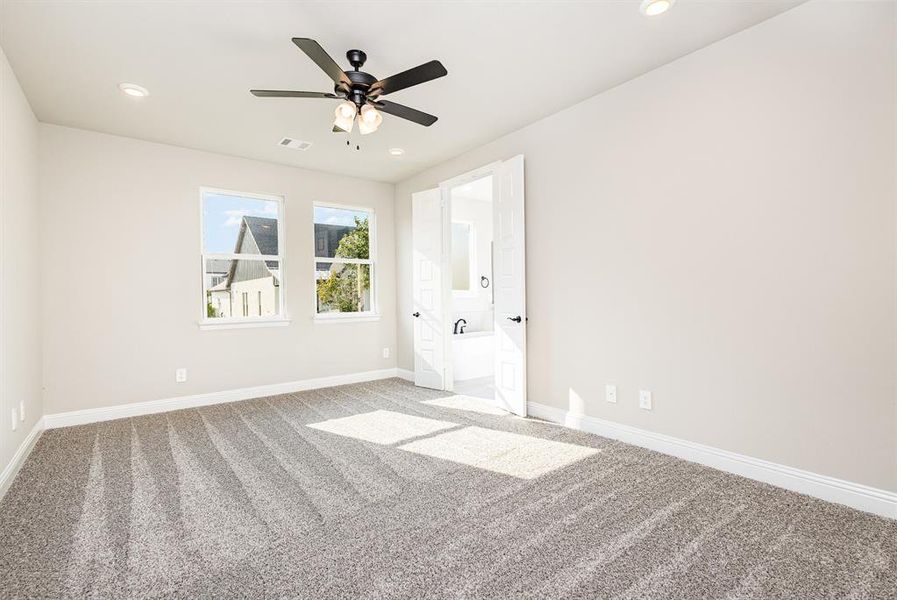 Unfurnished room with carpet floors, recessed lighting, and a ceiling fan