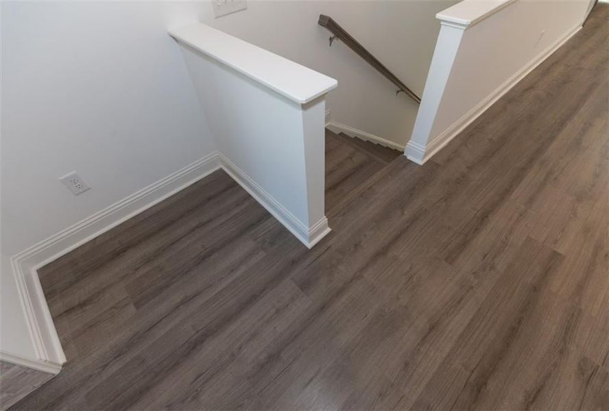 Gorgeous flooring will be found throughout the main level.  Carpet in bedrooms for extra coziness! Photo for representation purposes only, not of actual home but a  previously built TPG home.