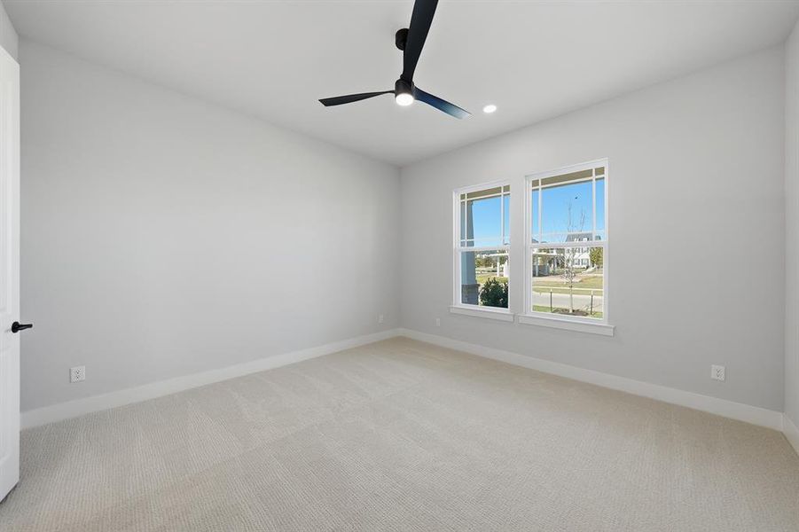 Unfurnished room with light carpet, recessed lighting, and a ceiling fan