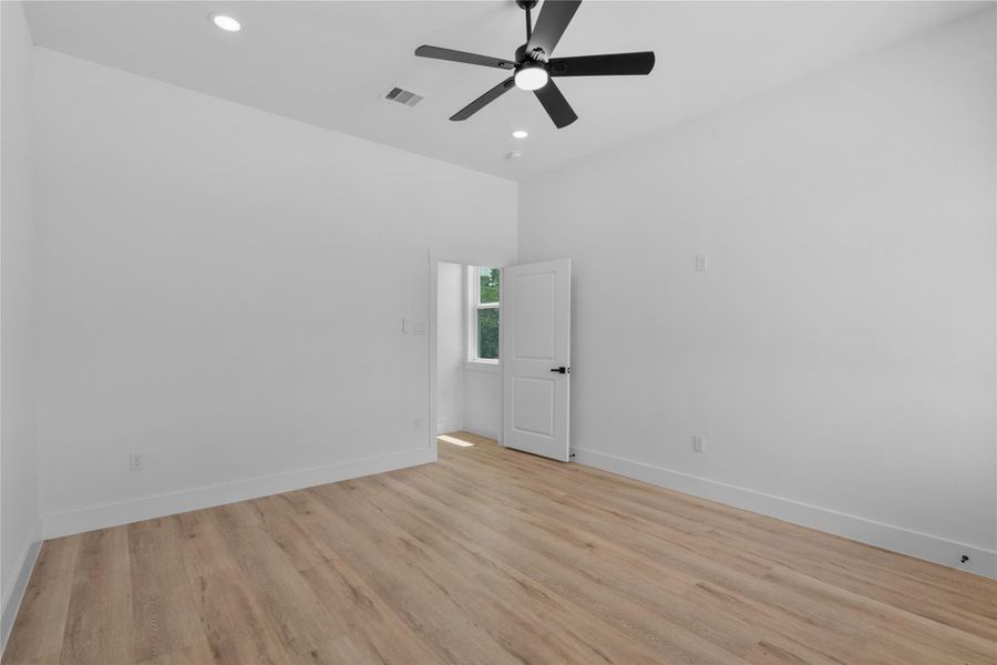 Bright and versatile bedroom featuring high ceilings, modern finishes and stylish wood-look flooring throughout. Bright and versatile bedroom featuring high ceilings, modern finishes and stylish wood-look flooring throughout.