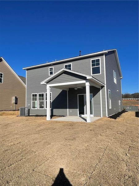 Exterior details and patio area of a home in Springwood Grove, Central (Image 18).