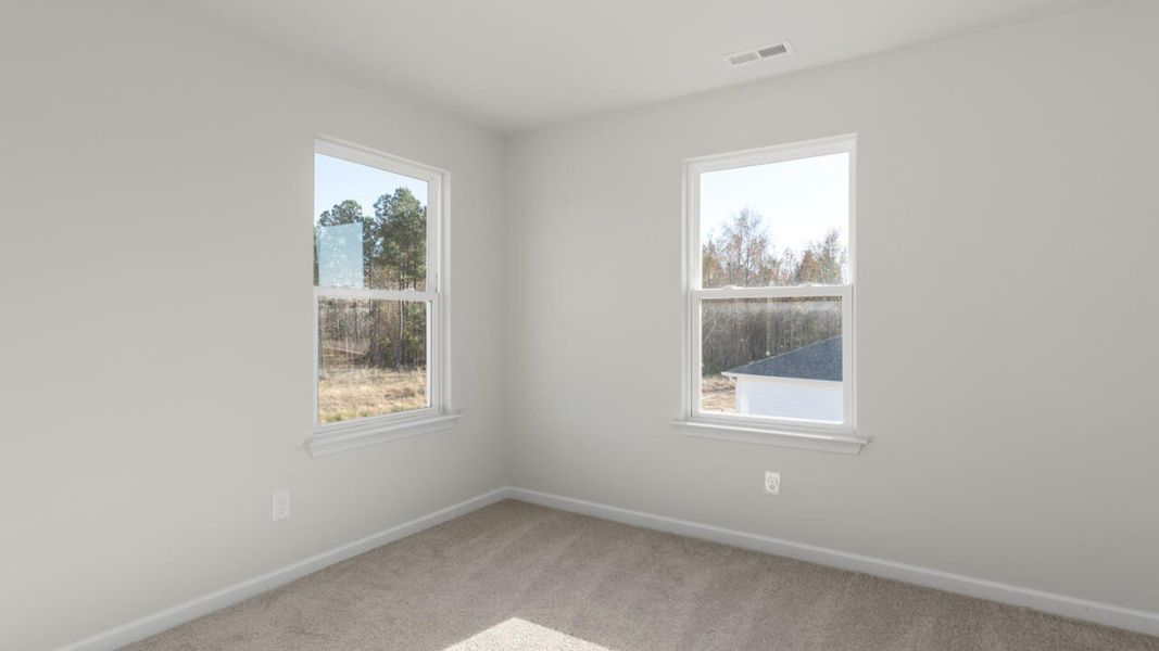 Spacious, unfurnished interior of a new home in Indigo Preserve, Leland (Image 35).