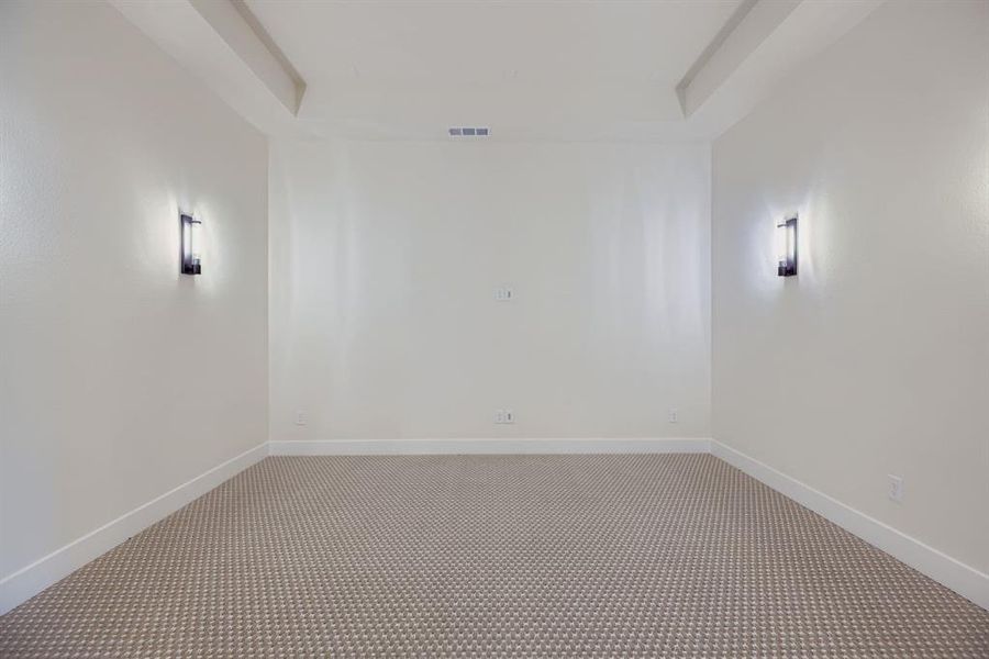 Empty room featuring carpet and baseboards Empty room featuring carpet and baseboards