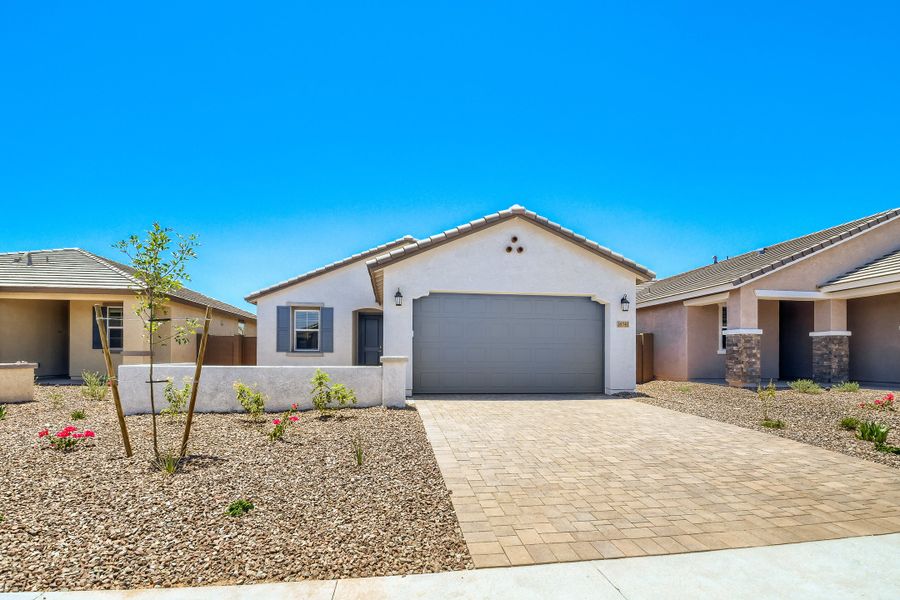 Front exterior of a new home in Montecito at Estrella, Goodyear, AZ, highlighting curb appeal (Image 1). Front exterior of a new home in Montecito at Estrella, Goodyear, AZ, highlighting curb appeal (Image 1).