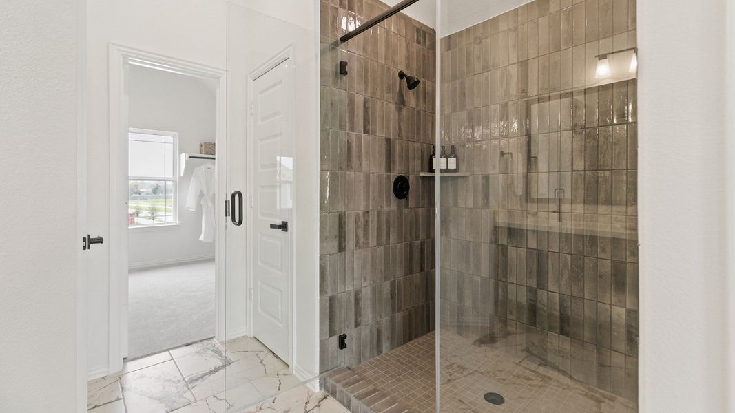 Representative furnished interior of a home built from the Mimosa by Brightland Homes in Sunterra, Katy (Image 22).