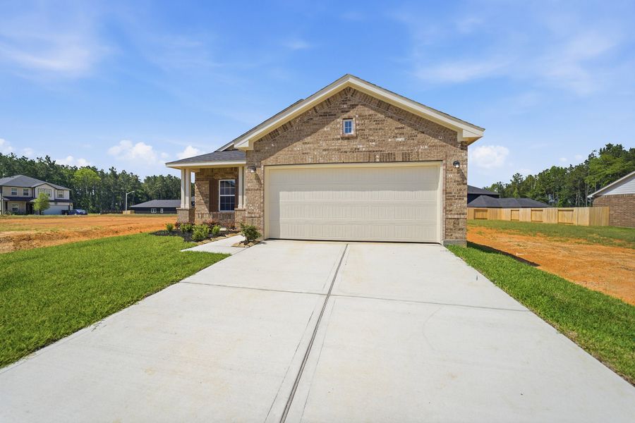 Front exterior of a new home in Magnolia Springs, Montgomery, TX, highlighting curb appeal (Image 2).