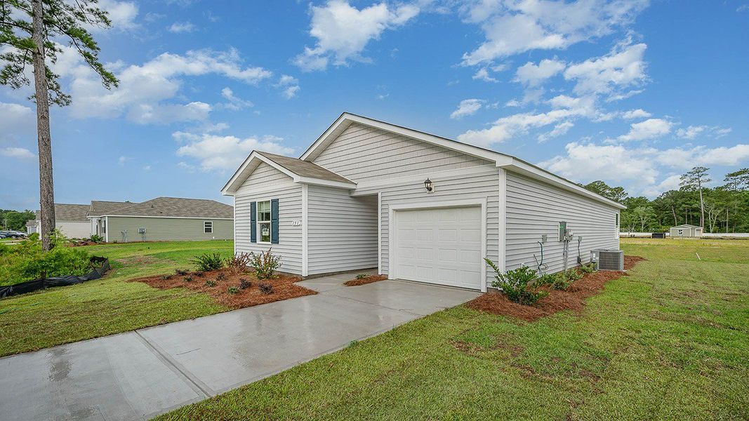 Front exterior of a new home in Auberon Woods, Conway, SC, highlighting curb appeal (Image 2). Front exterior of a new home in Auberon Woods, Conway, SC, highlighting curb appeal (Image 2).