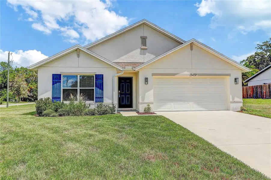 Front exterior of a new home in , Spring Hill, FL, highlighting curb appeal (Image 26).