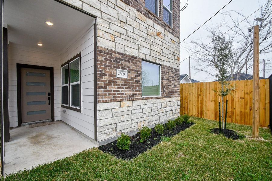 Front exterior of a new home in , Houston, TX, highlighting curb appeal (Image 19).