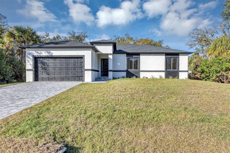 Front exterior of a new home in , Port Charlotte, FL, highlighting curb appeal (Image 30).