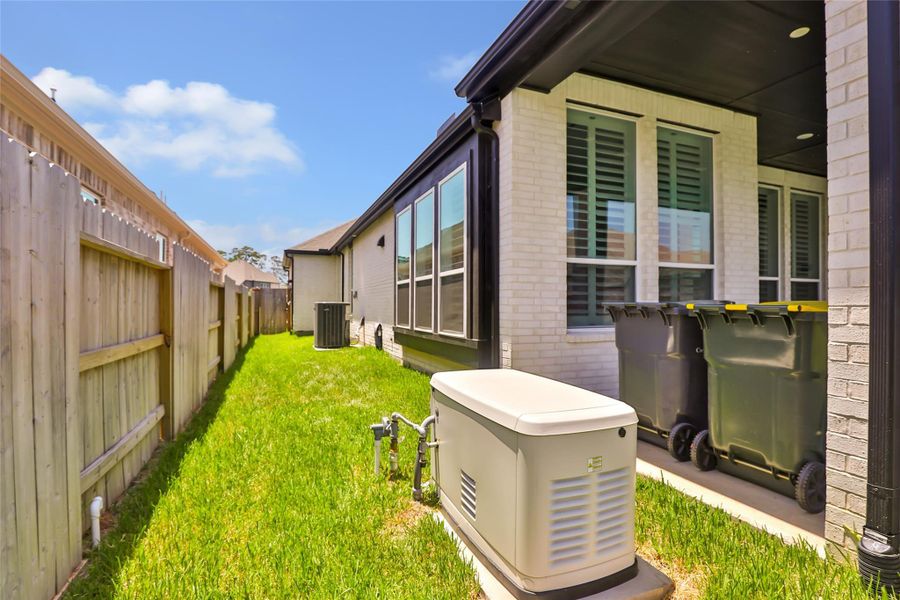 Exterior details and patio area of a home in Grand Central Park, Conroe (Image 3).