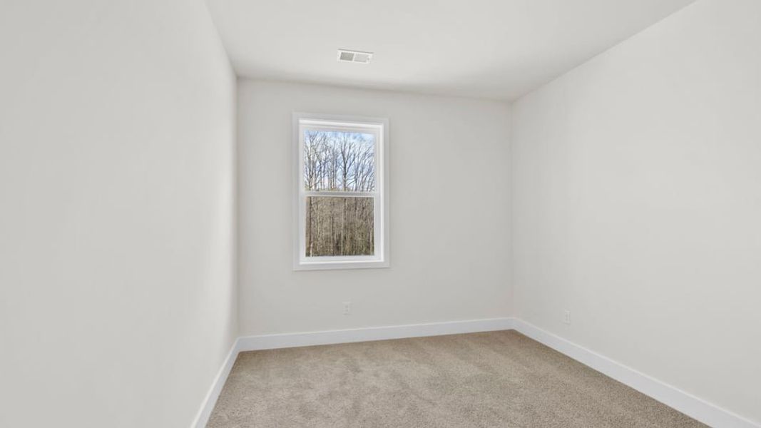 Spacious, unfurnished interior of a new home in Hemlock, Williamston (Image 28).