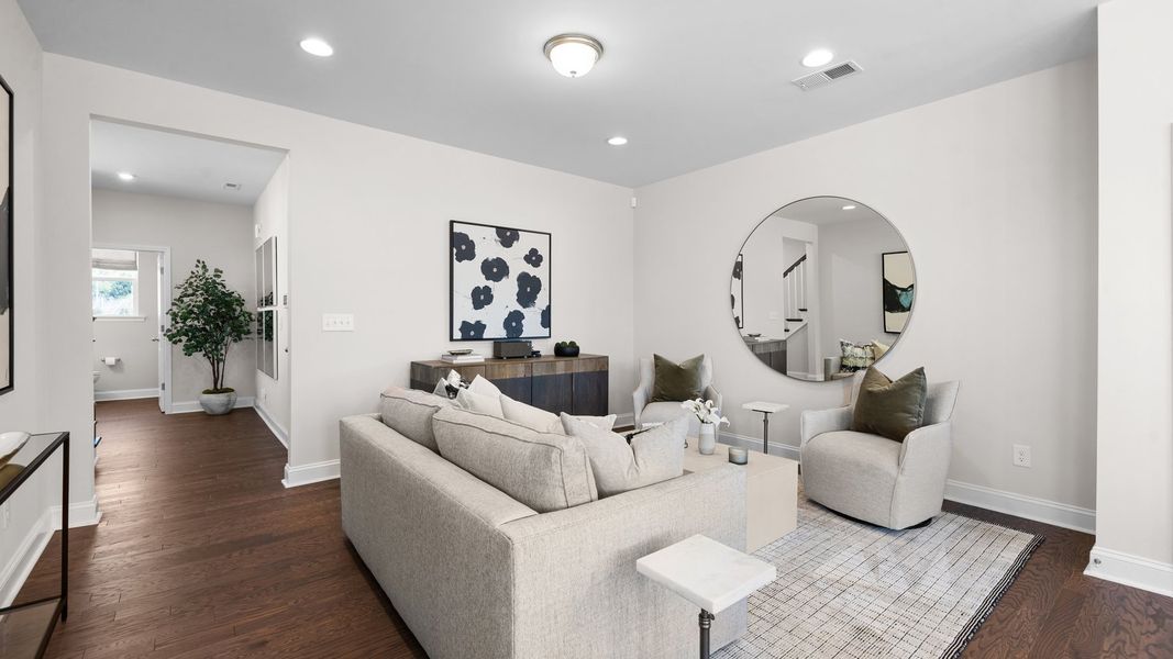 Family room with luxury vinyl plank flooring and elevated ceiling in the Rochester Design by DRB Homes Charlotte, NC Family room with luxury vinyl plank flooring and elevated ceiling in the Rochester Design by DRB Homes Charlotte, NC