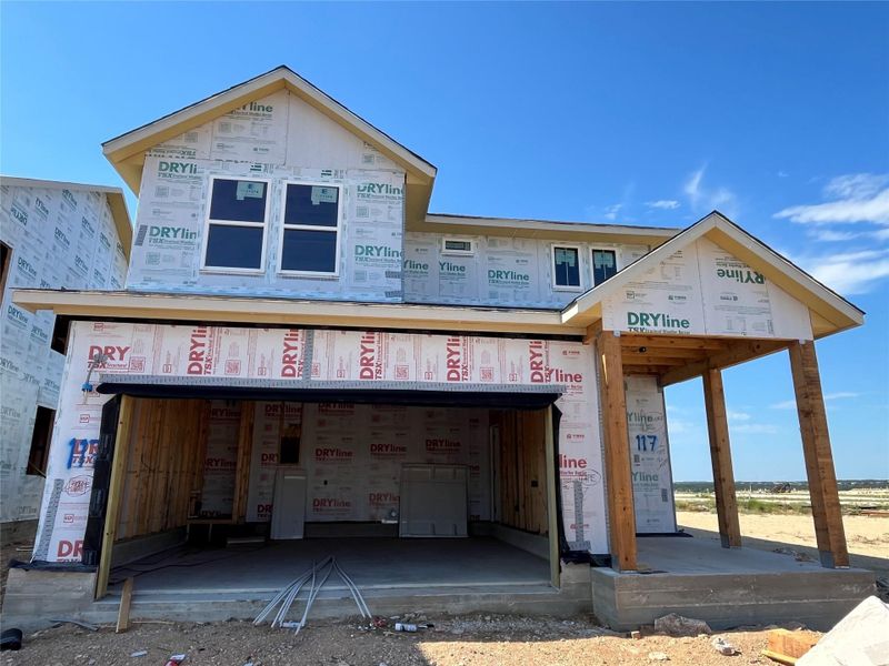Front exterior of a new home in The Homestead at Lariat, Liberty Hill, TX, highlighting curb appeal (Image 1). Front exterior of a new home in The Homestead at Lariat, Liberty Hill, TX, highlighting curb appeal (Image 1).