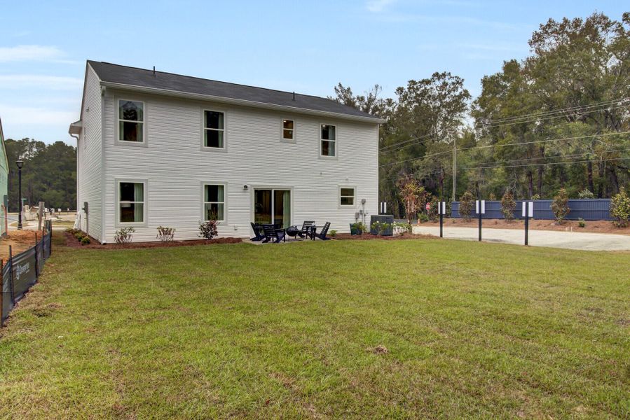 Exterior details and patio area of a home in Essence at Elms Glen Single Family Homes, Ladson (Image 3).