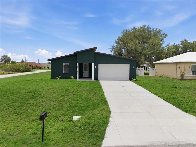 Front exterior of a new home in , North Port, FL, highlighting curb appeal (Image 27).