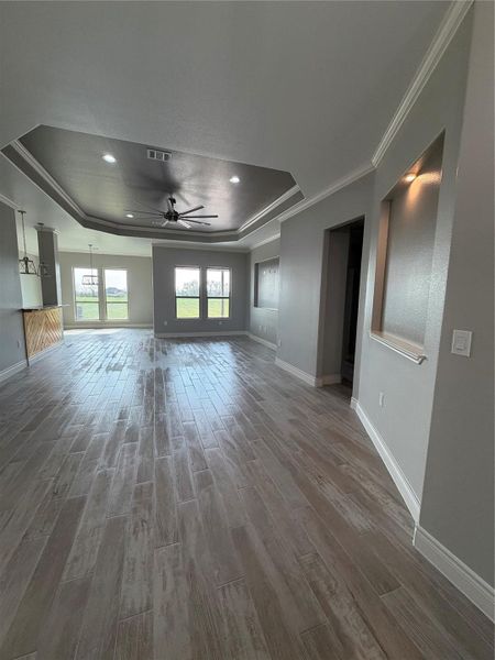 View of living area, and dining room from entry way