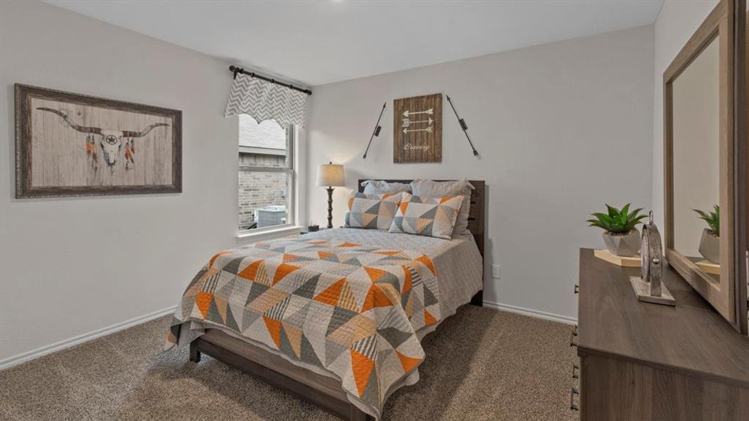 Bedroom featuring dark carpet