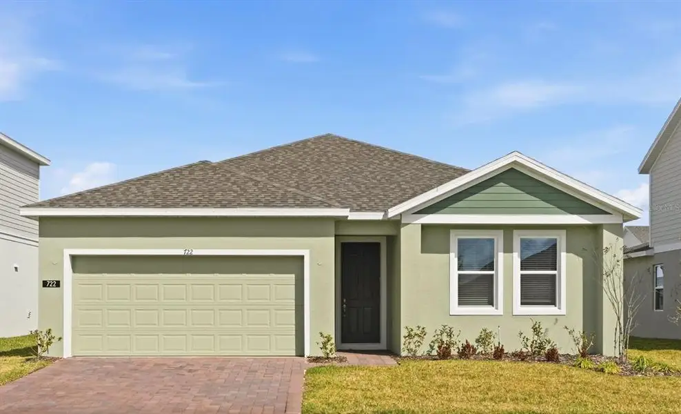 Front exterior of a new home in Marion Ridge, Haines City, FL, highlighting curb appeal (Image 2).