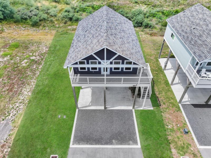 Front exterior of a new home in , Crystal Beach, TX, highlighting curb appeal (Image 18).