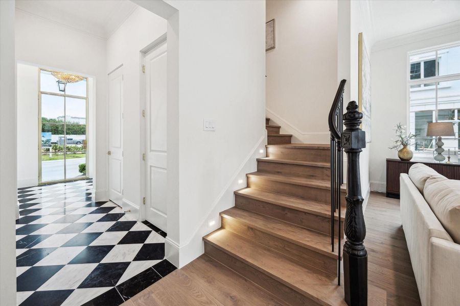 Additionally, black and white polished tile floor upgrade is available to create a bespoke entry. *Photo is of another home in the community and for informational purposes only. Additionally, black and white polished tile floor upgrade is available to create a bespoke entry. *Photo is of another home in the community and for informational purposes only.
