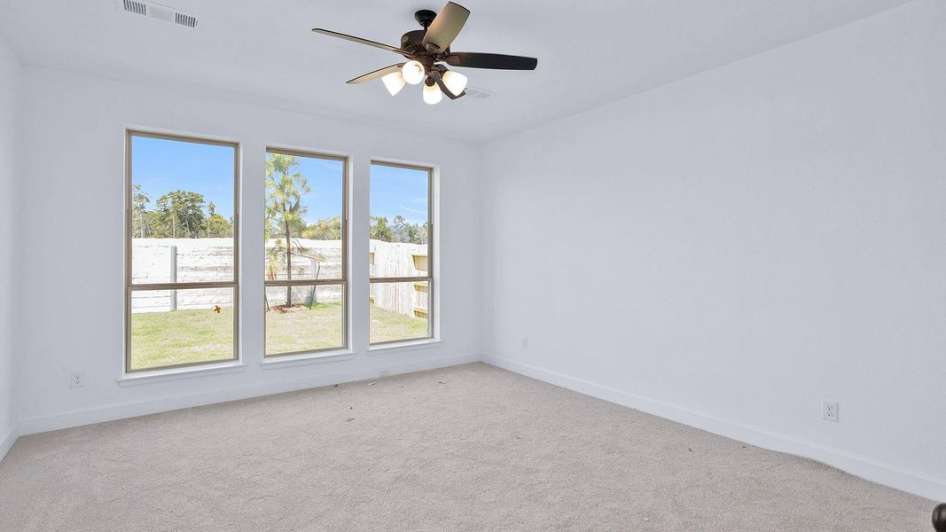 Spacious, unfurnished interior of a new home in Artavia 50', Conroe (Image 10).