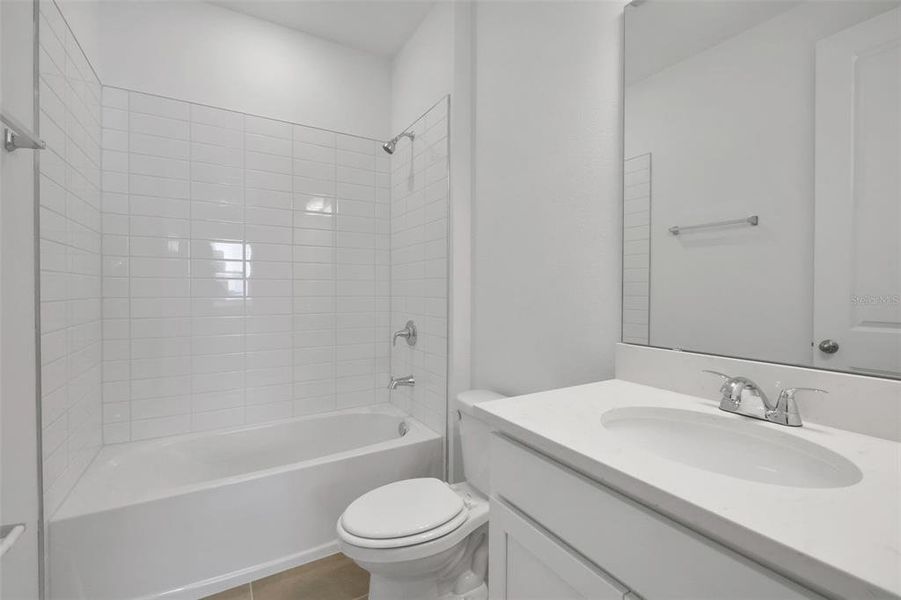 Furnished interior view inside a new home in Serenade at Ovation, Winter Garden (Image 11).