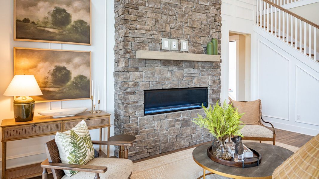 Gathering room with fireplace and access to staircase Gathering room with fireplace and access to staircase