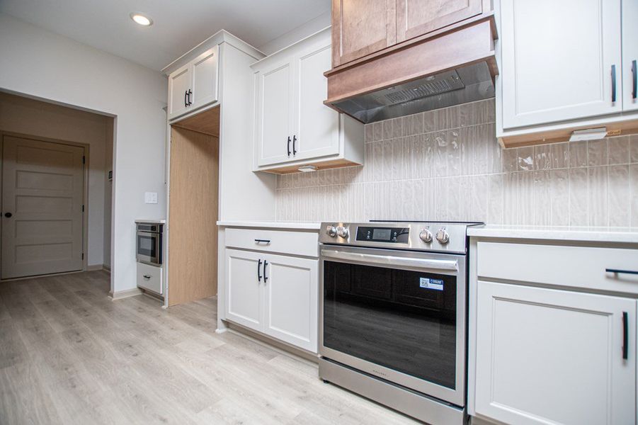 Furnished interior view inside a new home in WOODMONT RESERVE, Roopville (Image 12).