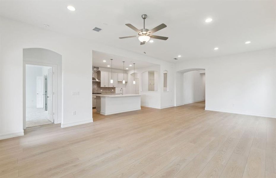 Sunlit gathering room designed for relaxation and entertainment  *Real home pictured