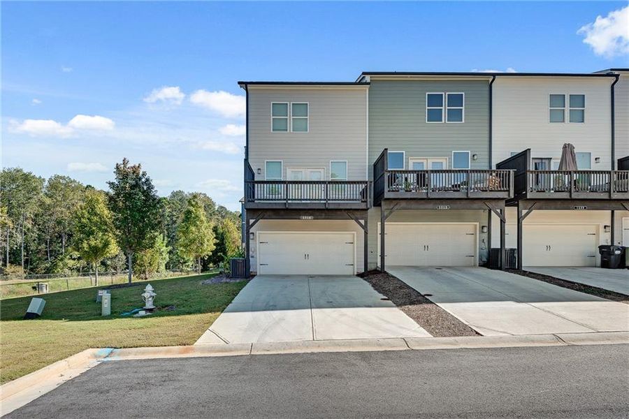 Front exterior of a new home in Waverly at Buice Lake, Acworth, GA, highlighting curb appeal (Image 2). Front exterior of a new home in Waverly at Buice Lake, Acworth, GA, highlighting curb appeal (Image 2).