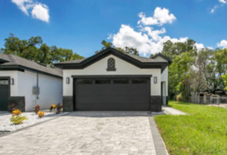 Front exterior of a new home in , Apopka, FL, highlighting curb appeal (Image 33).