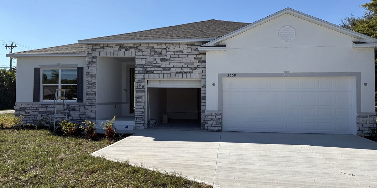 Front exterior of a new home in Cape Coral, Cape Coral, FL, highlighting curb appeal (Image 5).
