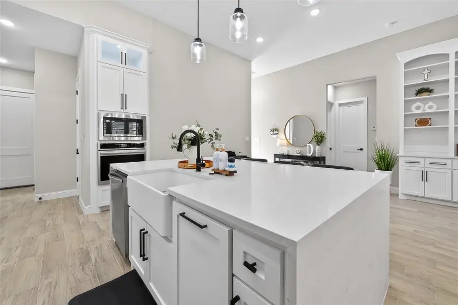 Large island with breakfast seating and open-concept layout. Large island with breakfast seating and open-concept layout.