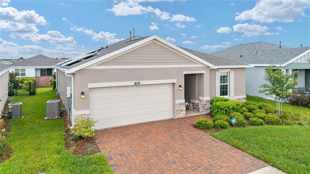 Front exterior of a new home in Ocala Preserve, Ocala, FL, highlighting curb appeal (Image 24).