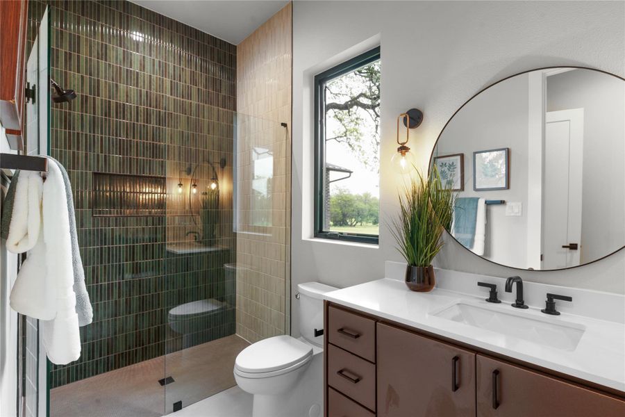 Full bathroom featuring tiled shower, toilet, and vanity Full bathroom featuring tiled shower, toilet, and vanity