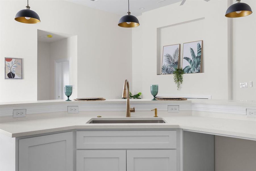 Kitchen featuring sink and pendant lighting