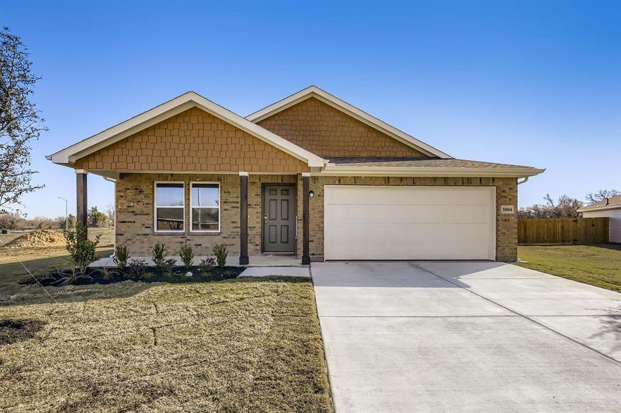 Front exterior of a new home in Middlefield Village, Dallas, TX, highlighting curb appeal (Image 17).