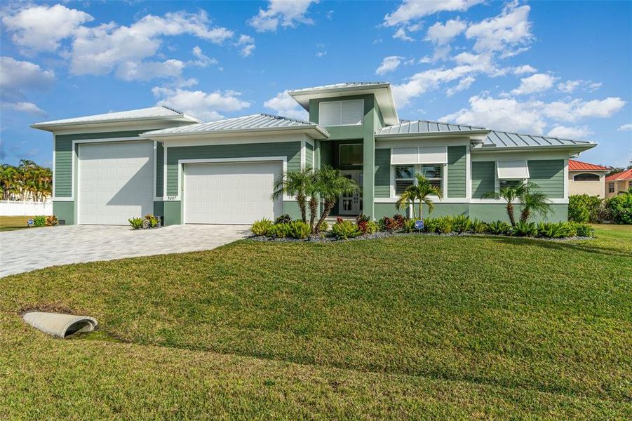 Front exterior of a new home in , Cape Coral, FL, highlighting curb appeal (Image 26).