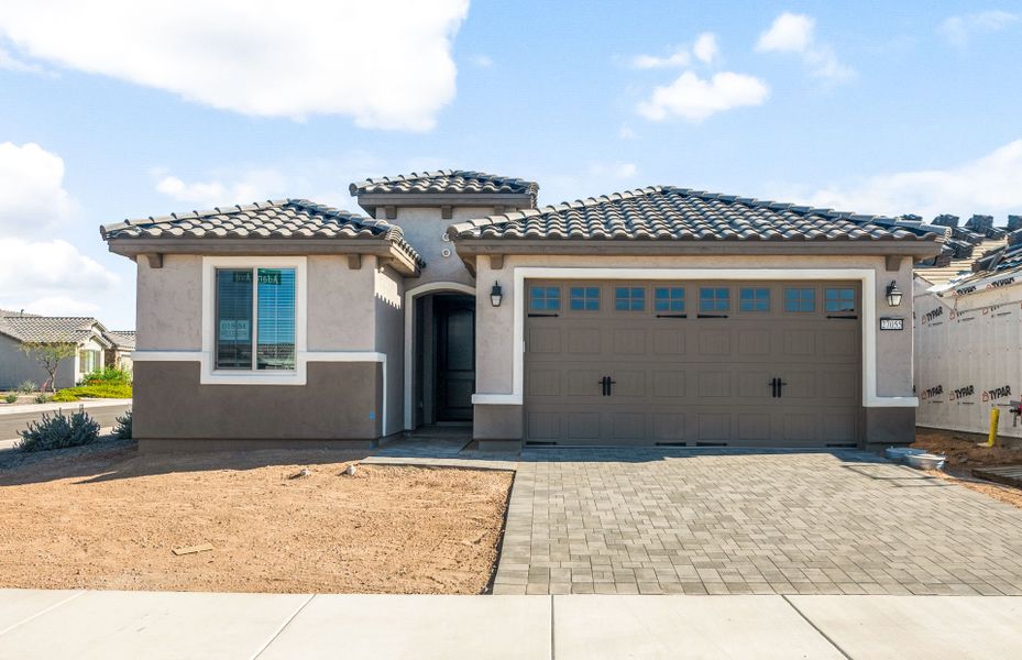 Front exterior of a new home in Sun City Festival, Buckeye, AZ, highlighting curb appeal (Image 19). Front exterior of a new home in Sun City Festival, Buckeye, AZ, highlighting curb appeal (Image 19).