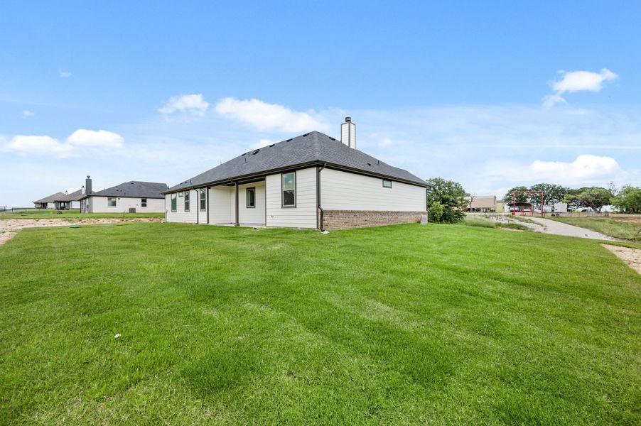 Front exterior of a new home in Saddleback Estates, Boyd, TX, highlighting curb appeal (Image 23).