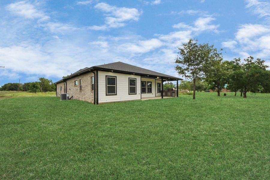 Front exterior of a new home in , Waller, TX, highlighting curb appeal (Image 26).