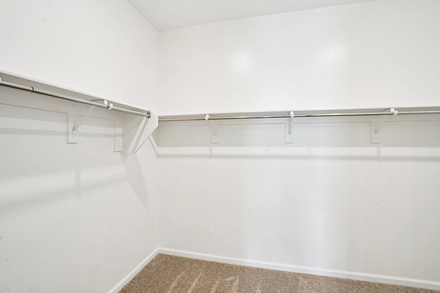 Primary walk in closet. Representative images and renderings are for illustrative purposes. Actual structural options and design finishes of home may vary.