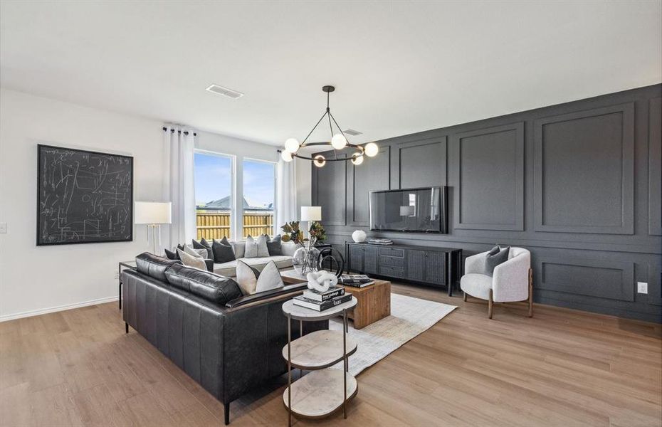 *Model Representation - Spacious gathering room with large windows