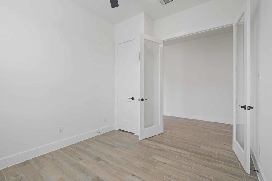 Representative unfurnished interior of a home built from the Malibu by Chesmar Homes in Fulshear Lakes, Fulshear (Image 22).