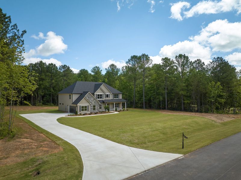 Front exterior of a new home in Flint Farms, Concord, GA, highlighting curb appeal (Image 2).