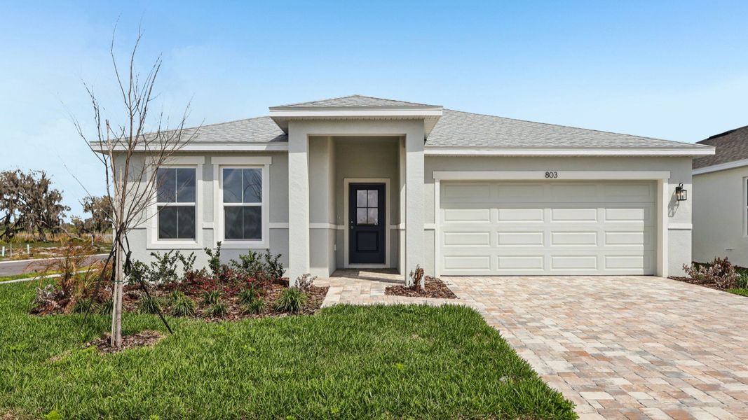 Representative exterior photo of a completed home built from the Castaway Multi-Gen by DRB Homes in Willowbrook North, Winter Haven, FL (Image 22).