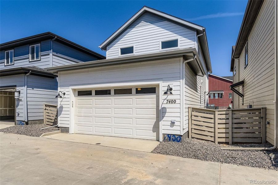 Front exterior of a new home in The Villas Collection at Sterling Ranch, Littleton, CO, highlighting curb appeal (Image 2).
